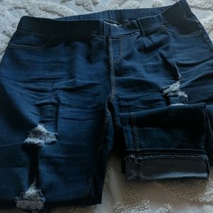 Women's destressed blue jean pull on